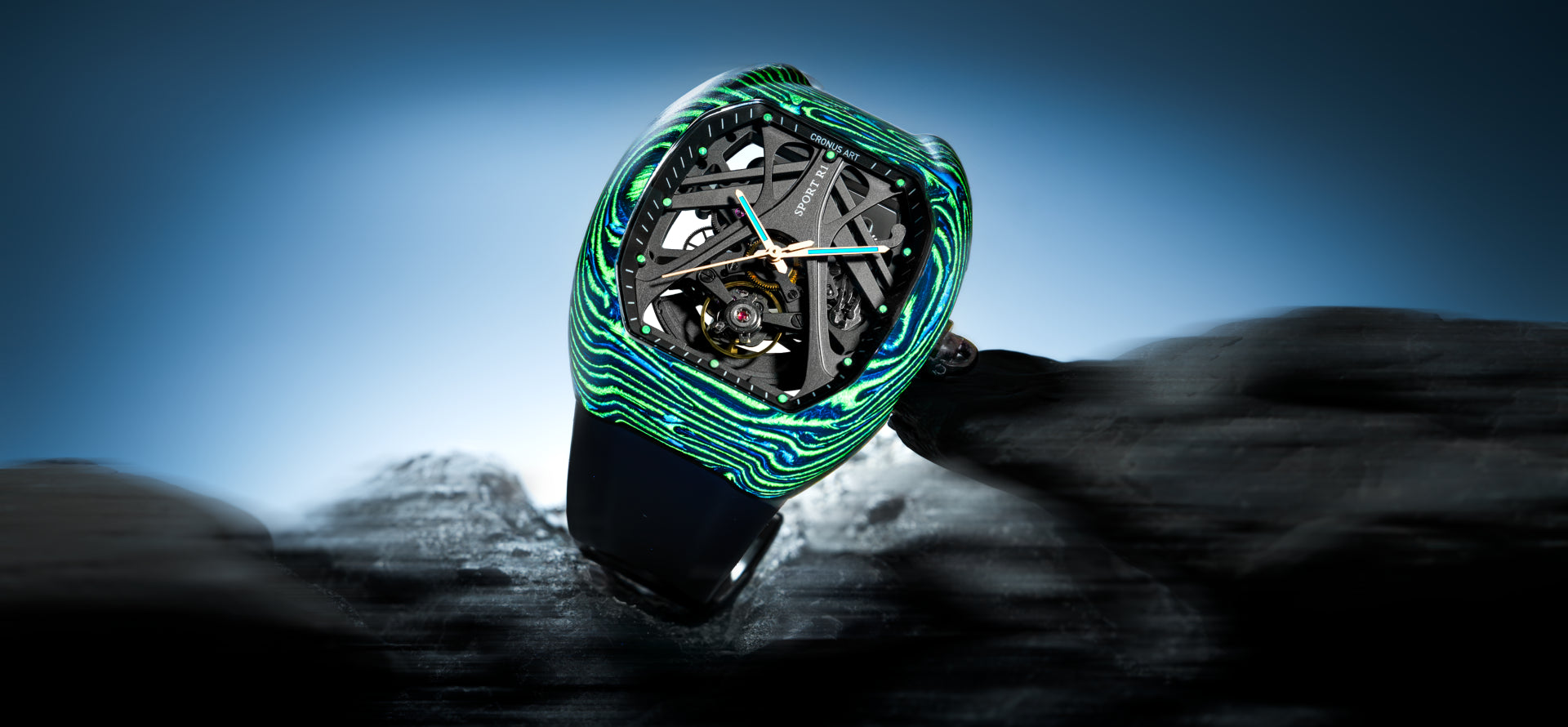 A luxury wristwatch with a distinctive green and blue wavy bezel, showcasing a complex skeletonized dial with metallic gears, resting on a dark textured surface against a blue gradient background.